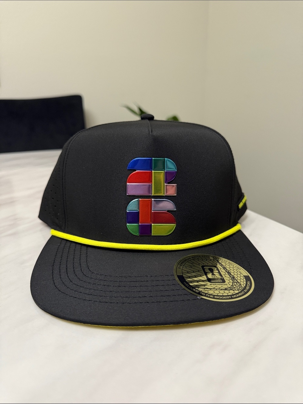 Black Snapback Hat with Multicolor Patch and Yellow Trim